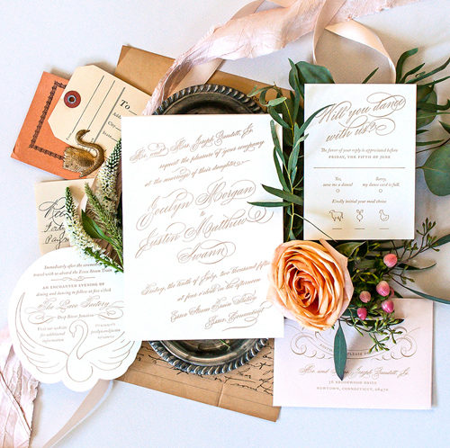 Romantic gold script letterpress wedding invitation with swan detail